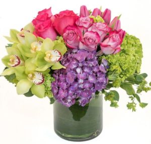 pink roses, green orchids and purple and green hydrangea