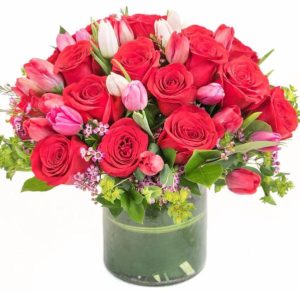 pink tulips with red roses in vase