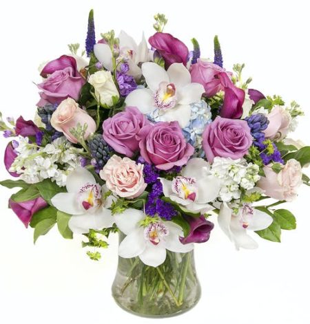Send an abundance of love and elegance with this stunning work of art comprised of premium floral varieties, including hydrangea, roses, orchids & more!